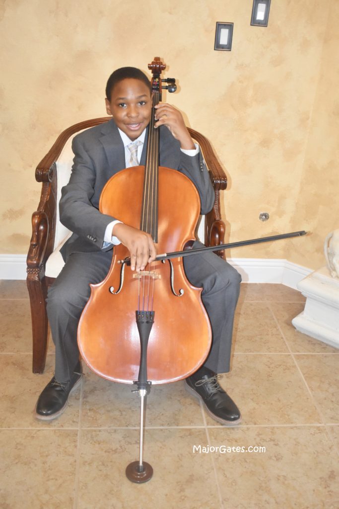 Son playing cello