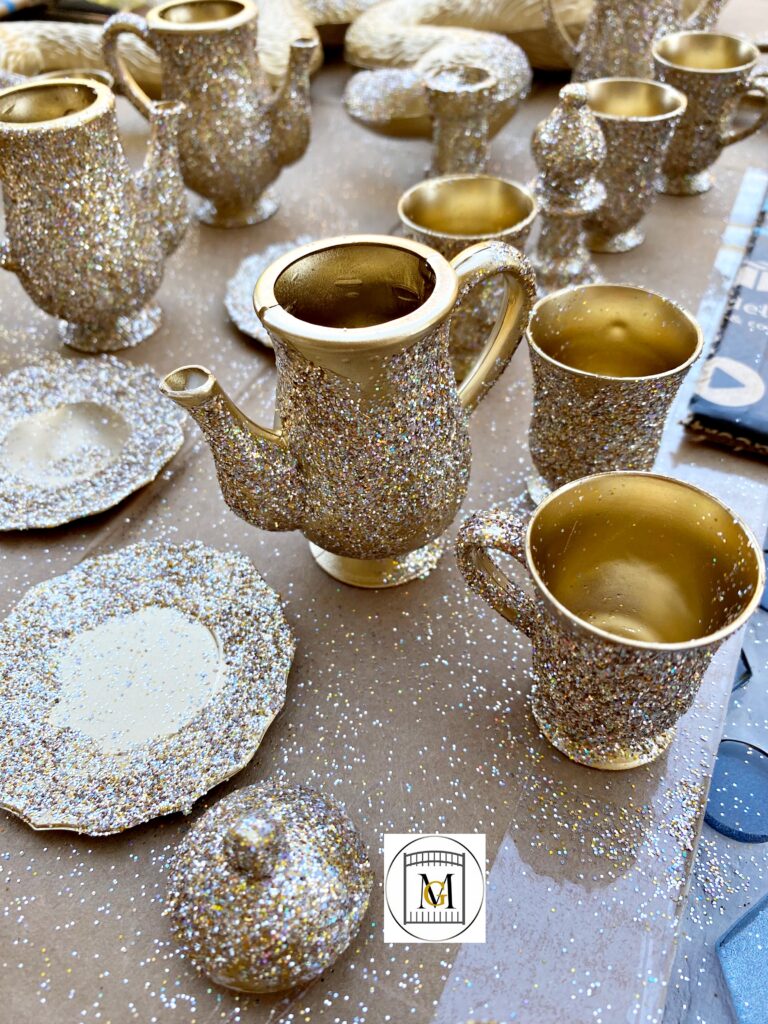 Painted gold plastic tea set